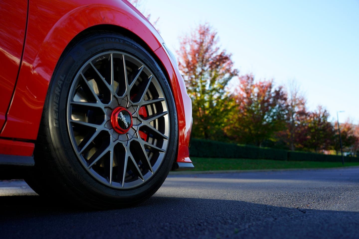 General Altimax 365AW Tire on a red passenger car